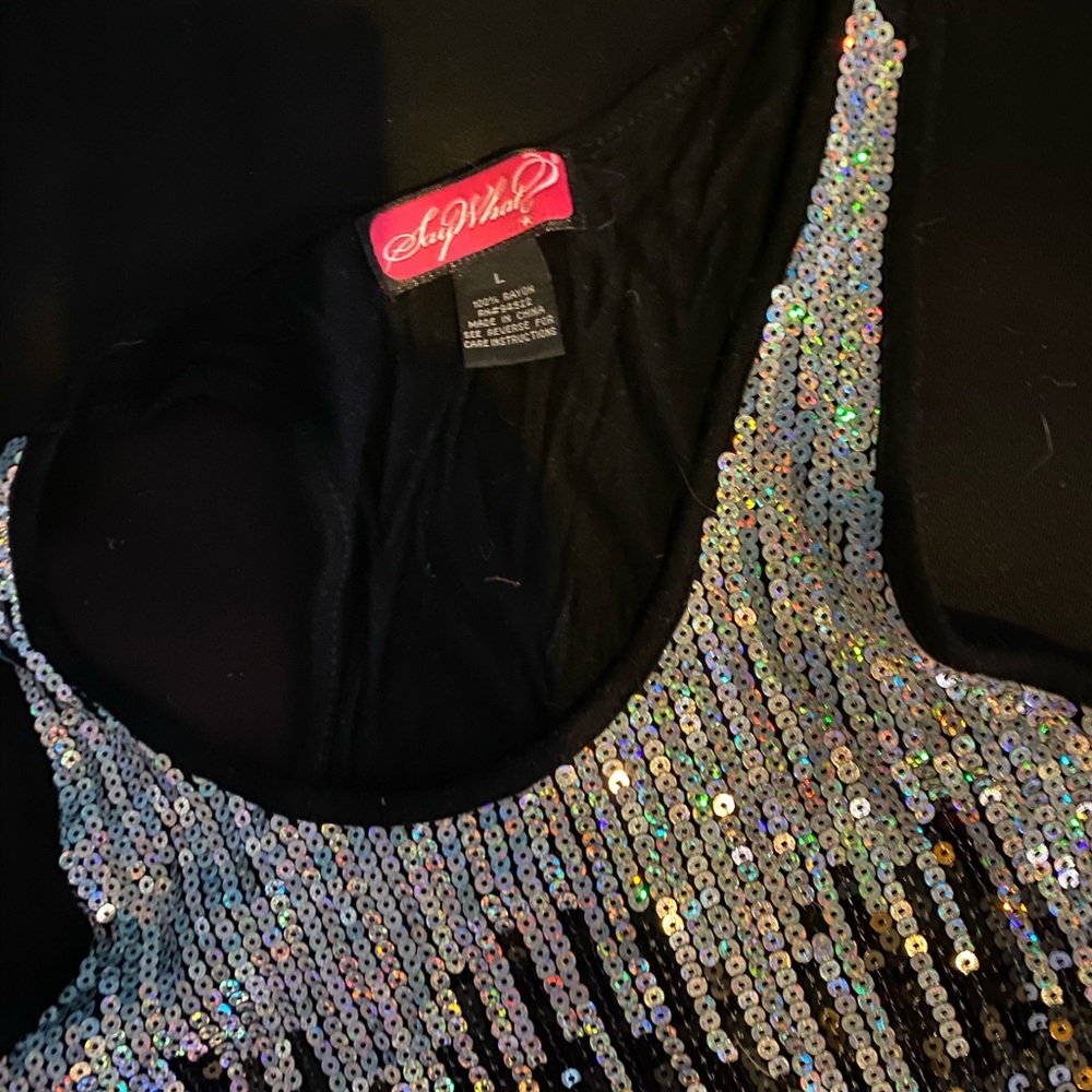 A cute dressy tank top with sequins on the front.